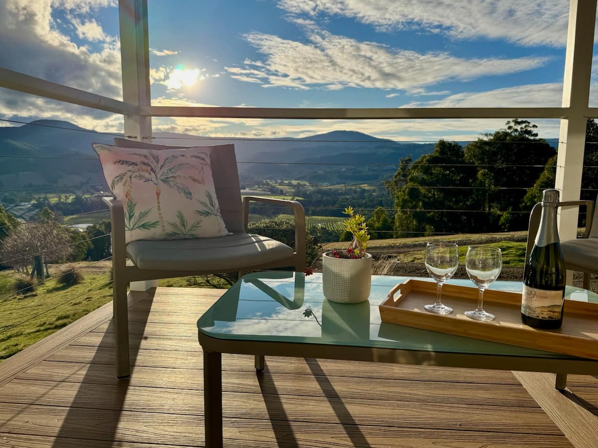 Sunny deck with coffee setting and valley view
