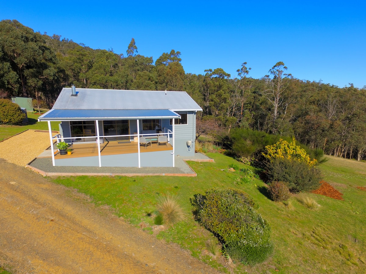 Aerial view of the cottage and surrounding acreage